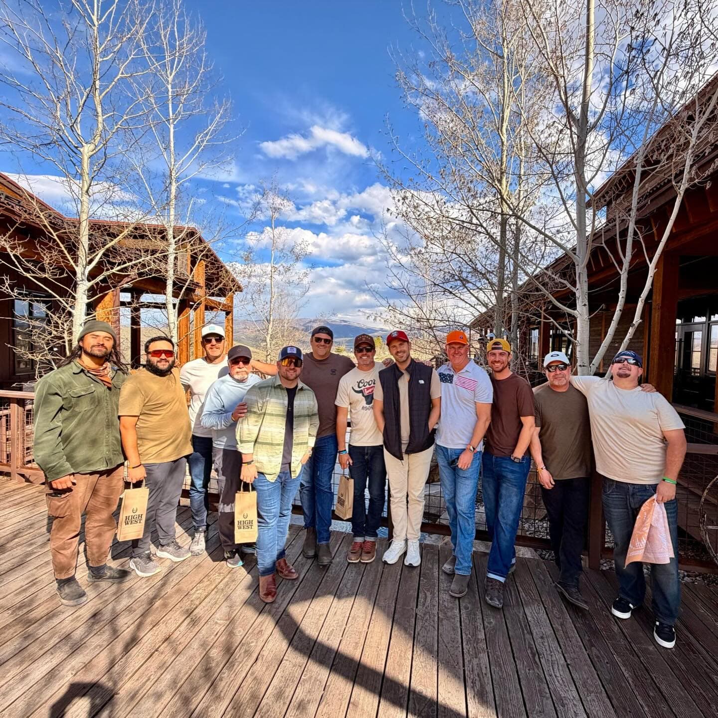 Men gathered on a mountain lodge deck